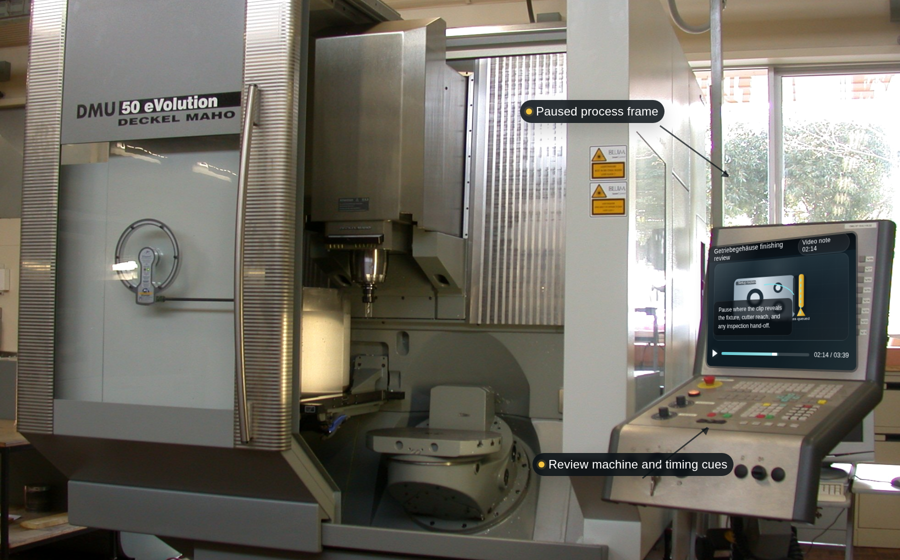 Workshop monitor showing a paused precision finishing process video for a gear housing (Getriebegehaeuse)